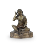 Picture of A bronze statue of Milarepa seated in a meditative pose