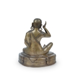Picture of A bronze statue of Milarepa seated in a meditative pose